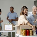 medium-shot-smiley-people-with-food-donations